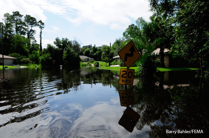 Flooding in a neighborhood after Tropical Storm Fay. Photo by Barry Bahler/FEMA