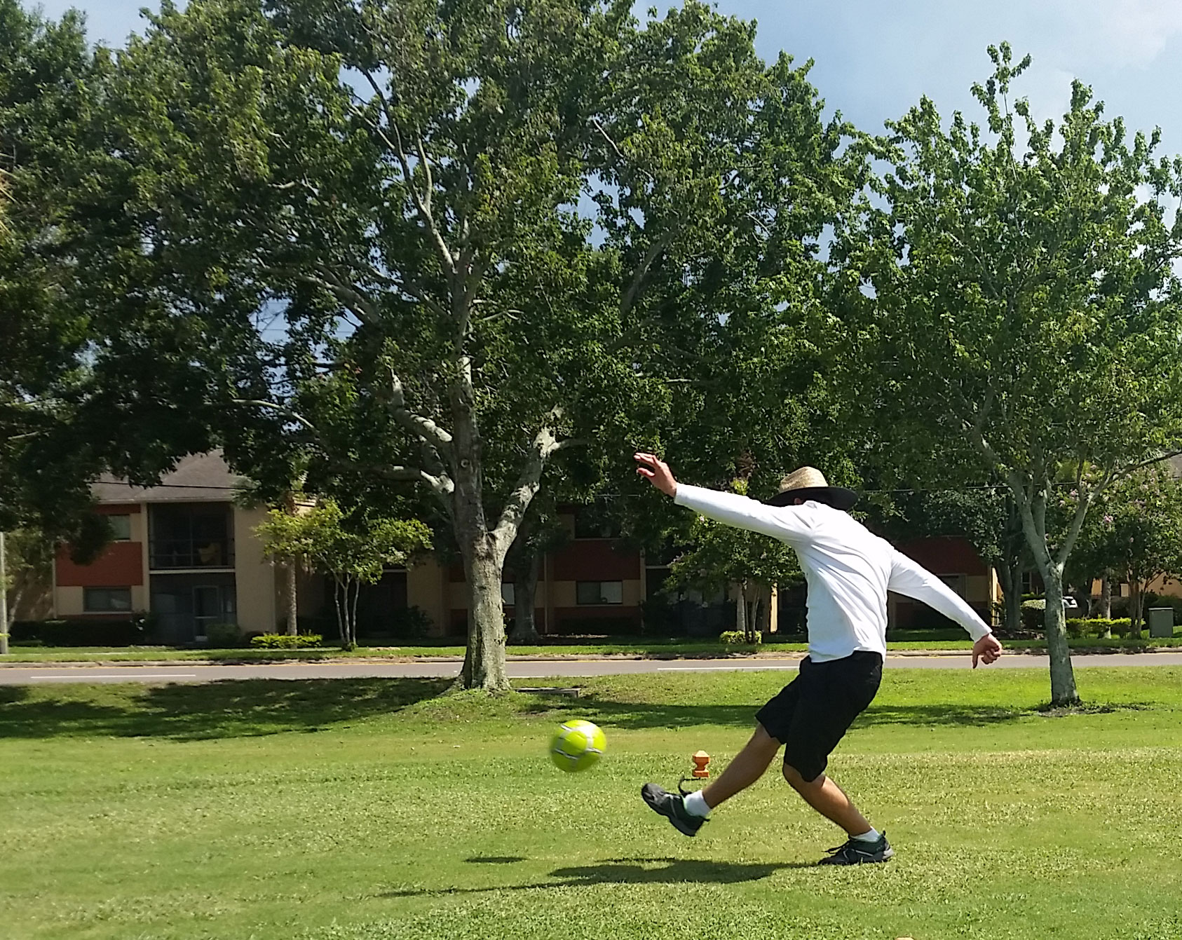 Man kicking ball in footgolf game