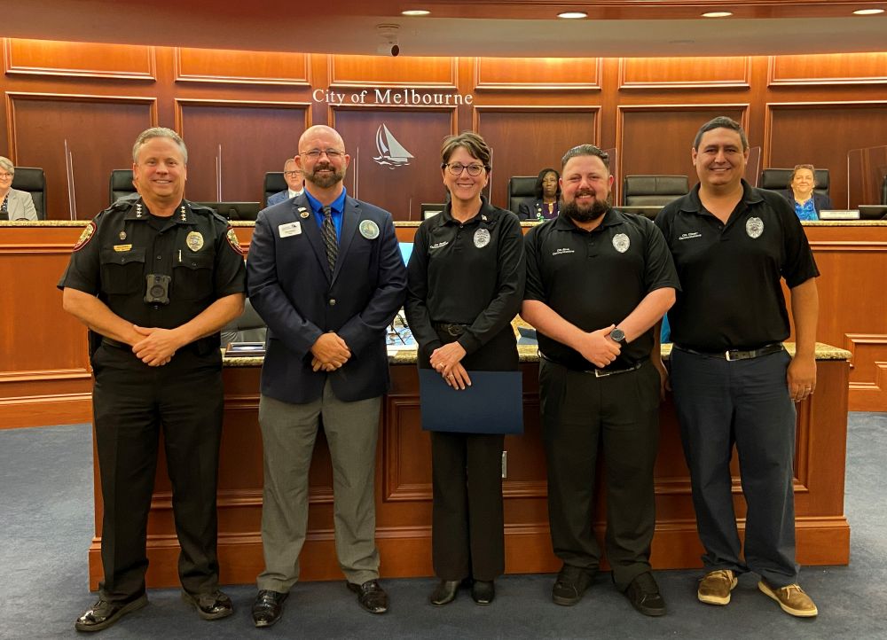 Police Chief and Mayor with Communications Center Staff in the Council Chamber