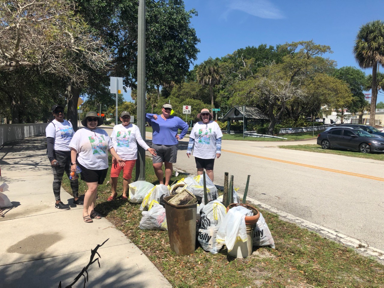 Group of Trash Bash volunteers and bags of trash at Manatee Park