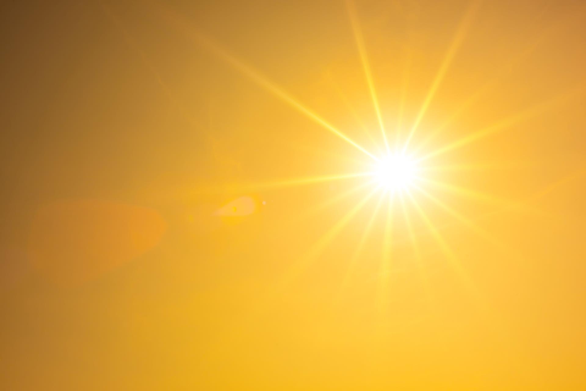 Bright summer sun with orange sky background (iStock)