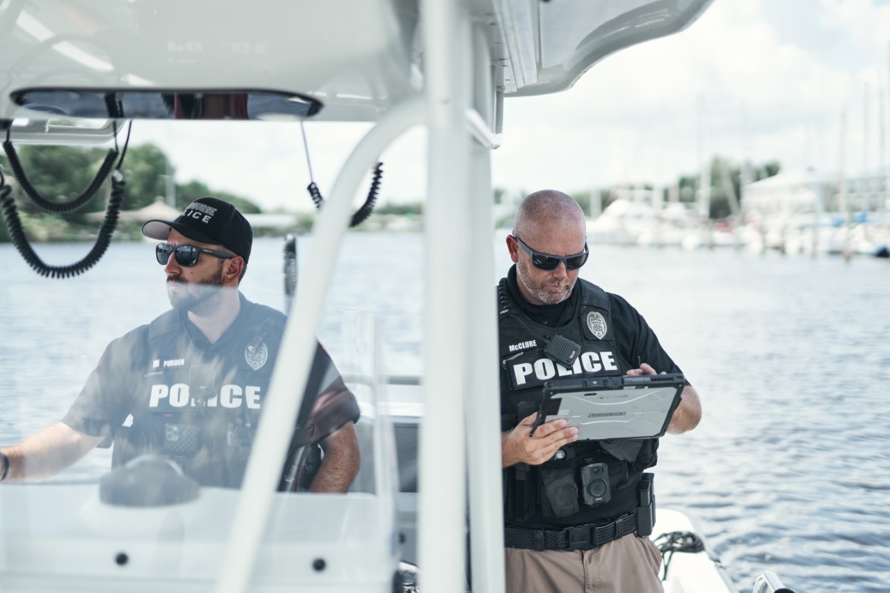 Two Melbourne Police officers on marine patrol boat.