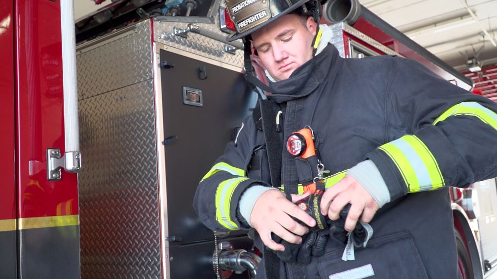 Melbourne firefighter putting on gear