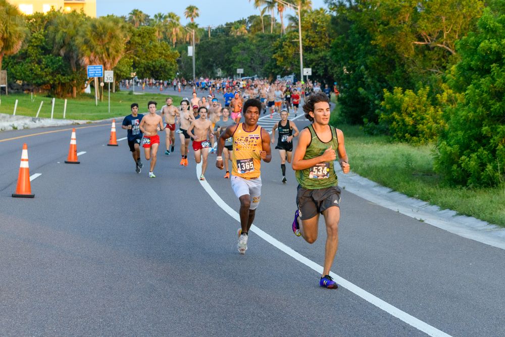 Runners running at the start of the Running Zone 2023 FireCracker 5K race course