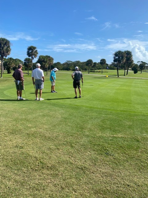 Four golfers on the Harbor City Golf Course