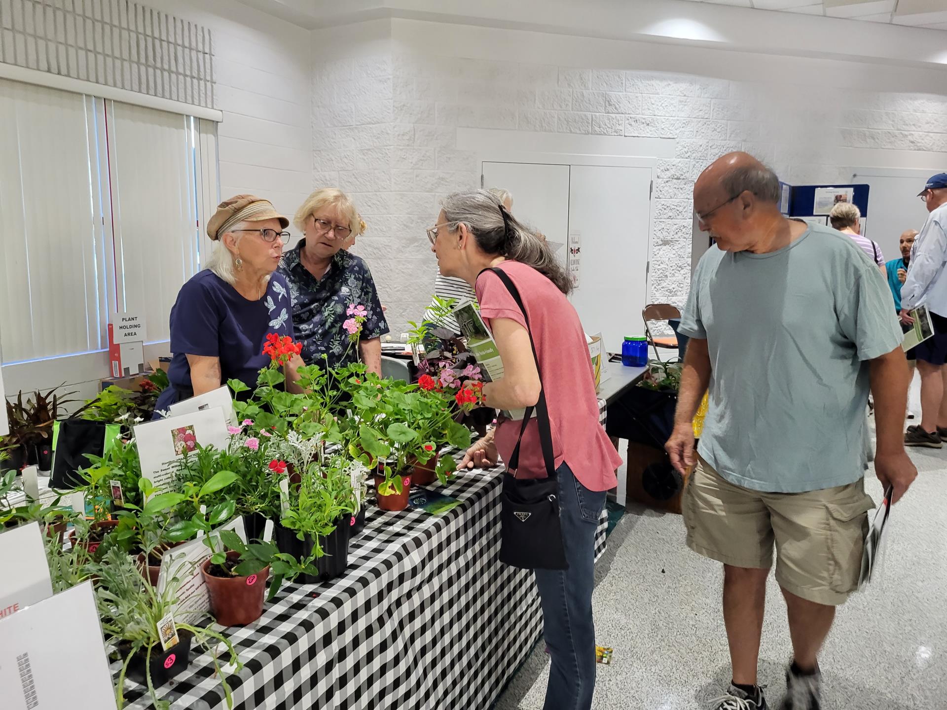 Florida Friendly Landscaping Seminar attendee at native plant vendor exhibit