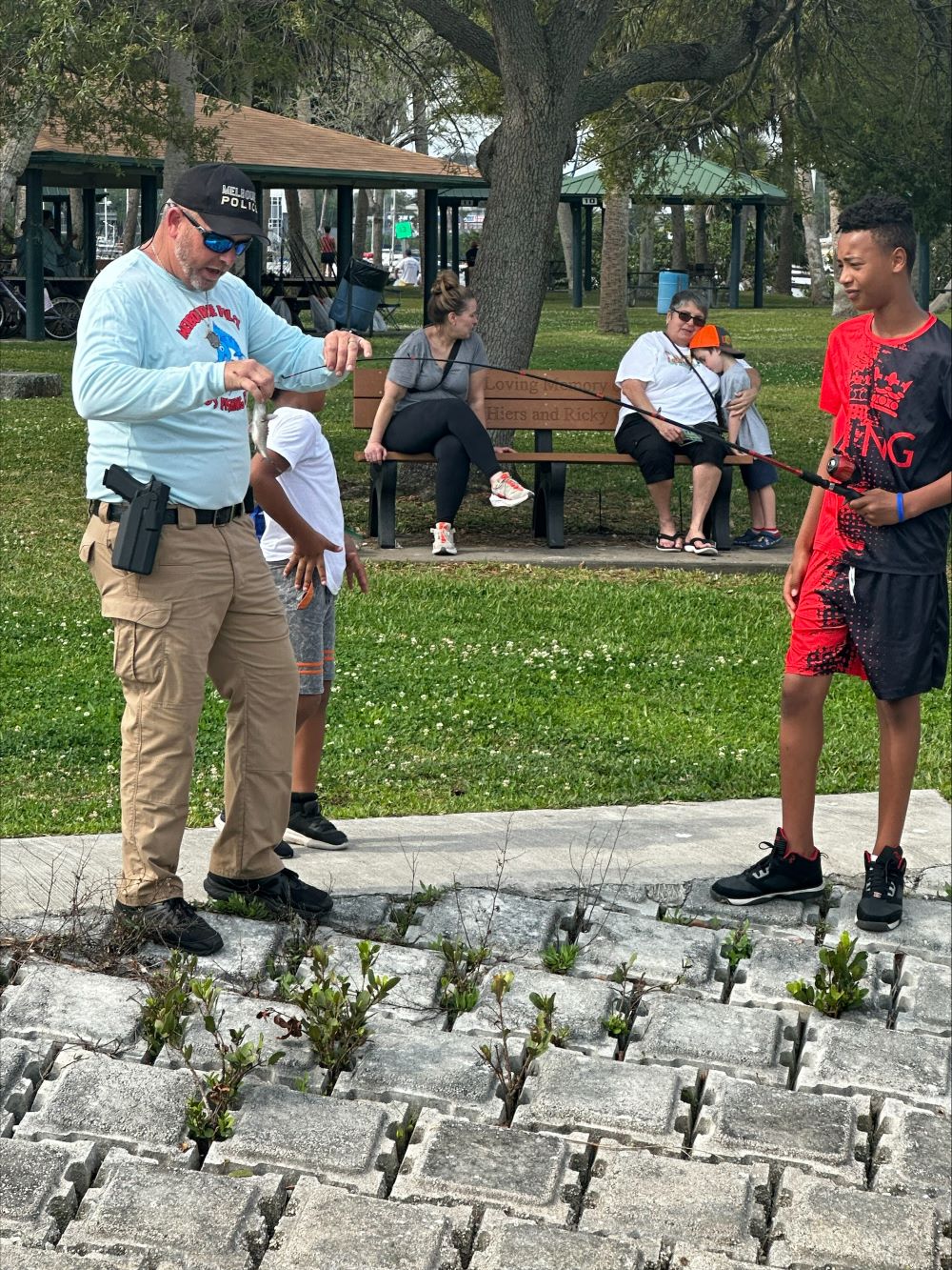 MPD officer helps kid with bait