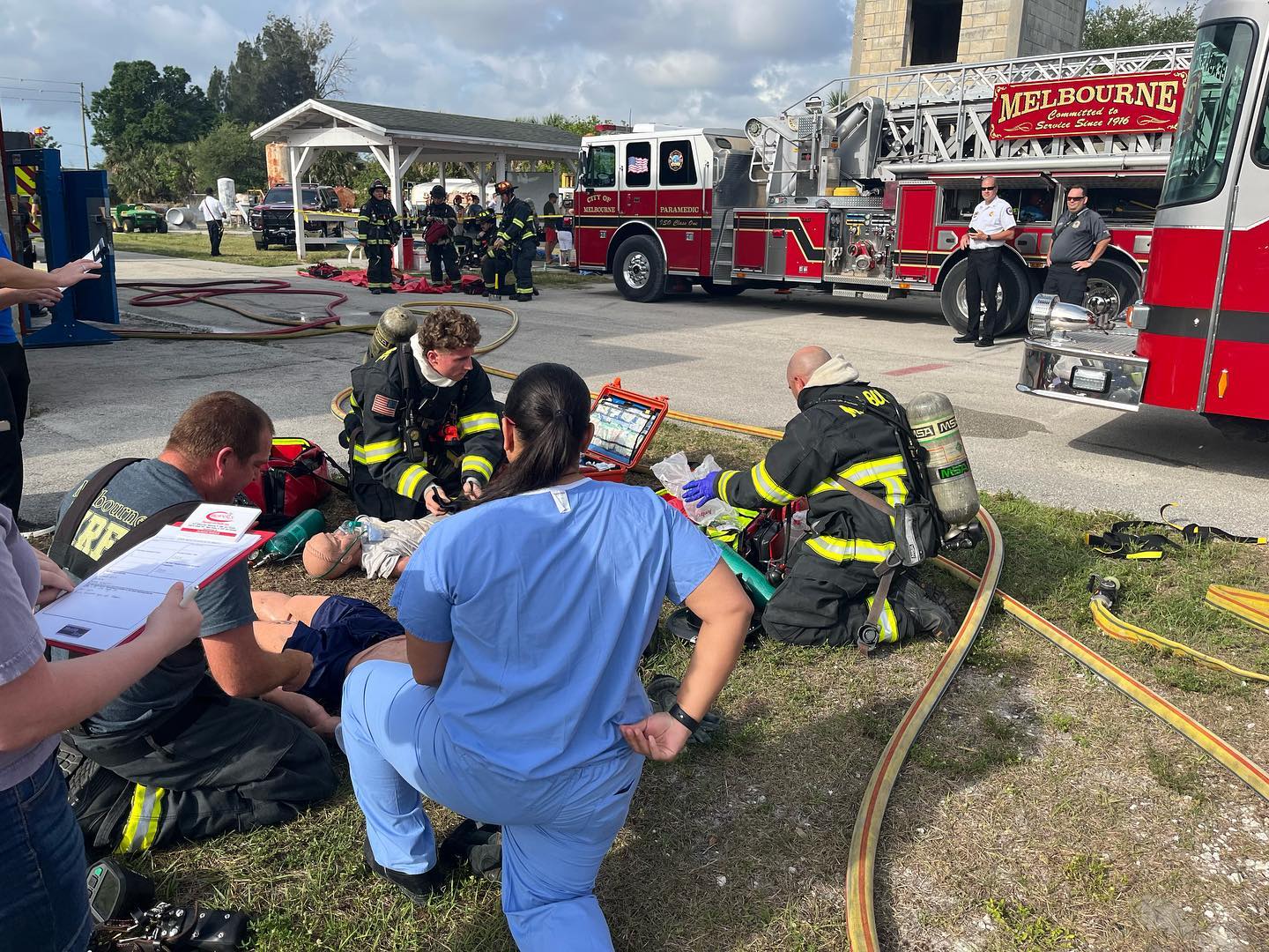 Melbourne and Health First EMS professionals work on a test dummy during a trauma response training drill.