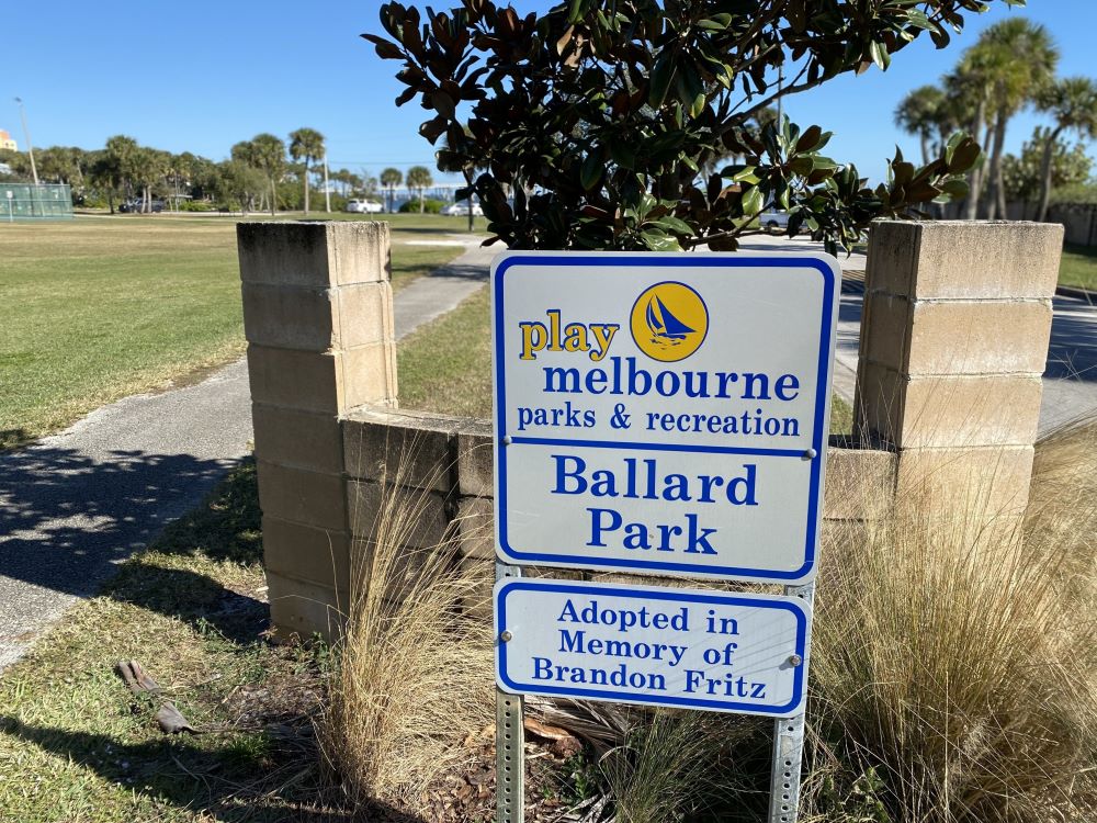 Ballard Park sign with sign that says Adopted in Memory of Brandon Fritz