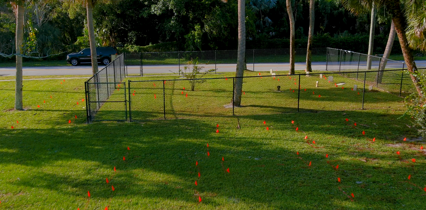 Flags mark location of grave sites found using ground-penetrating radar at Line Street Cemetery